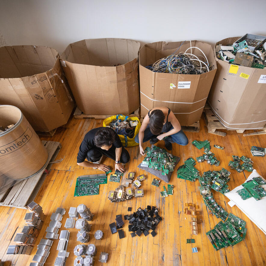 Sorting through Electronic Waste E-Waste Art installation