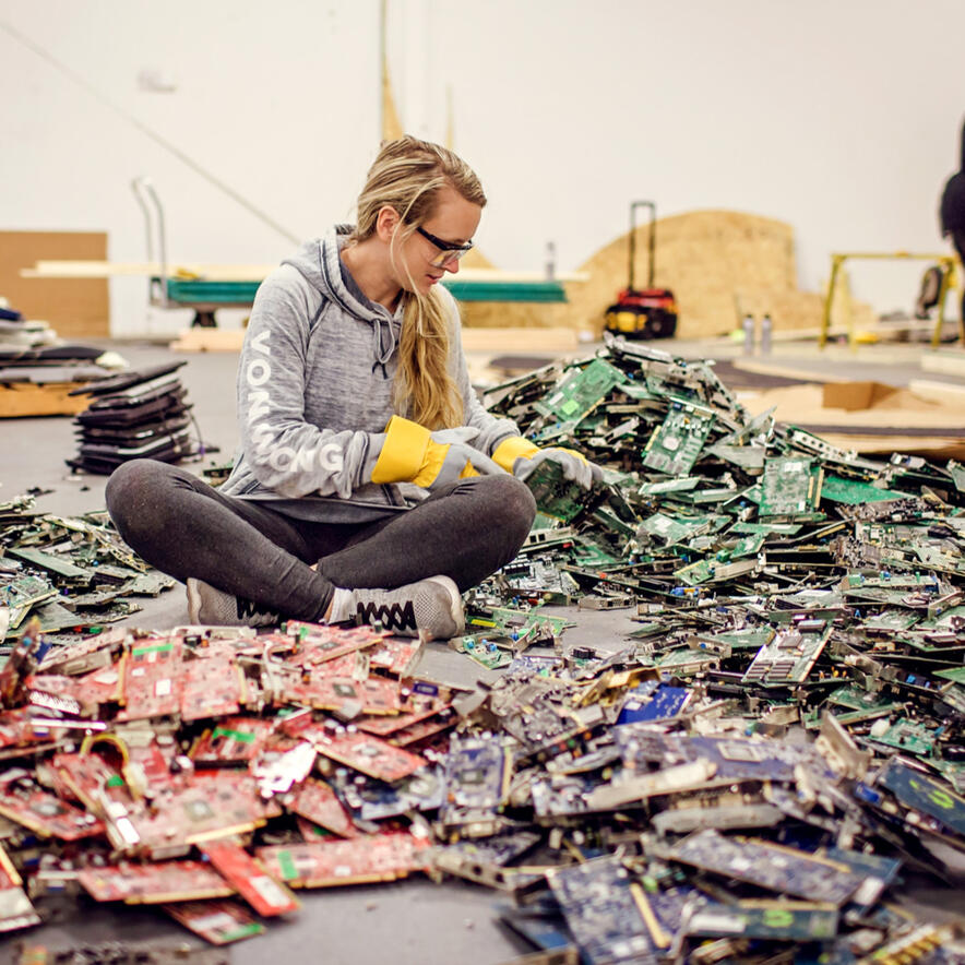 Sorting through Electronic Waste E-Waste Art installation